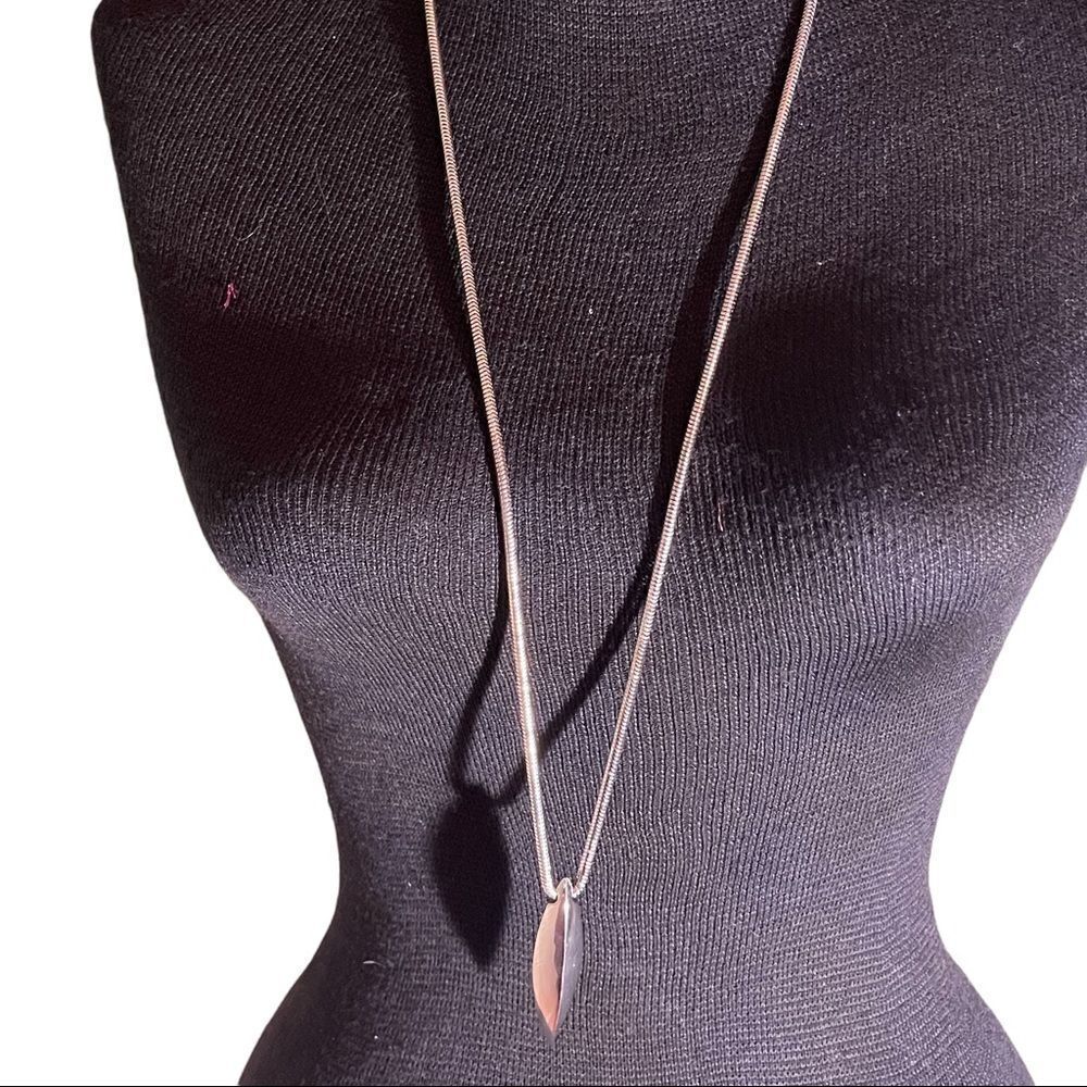 Nicole Miller Silver tone ping necklace.